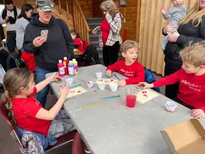 Kids painting animal tracks at EEC