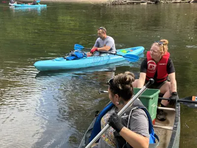 Volunteers in canoes at Elkhart River Cleanup event