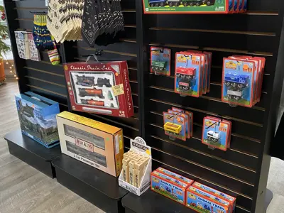 Merchandise available for purchase at the NNYCRRM giftshop, including toys, bandanas, patches, and stickers