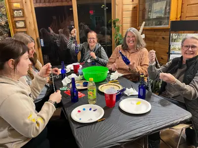 Group making upcycled wind chimes at program at EEC