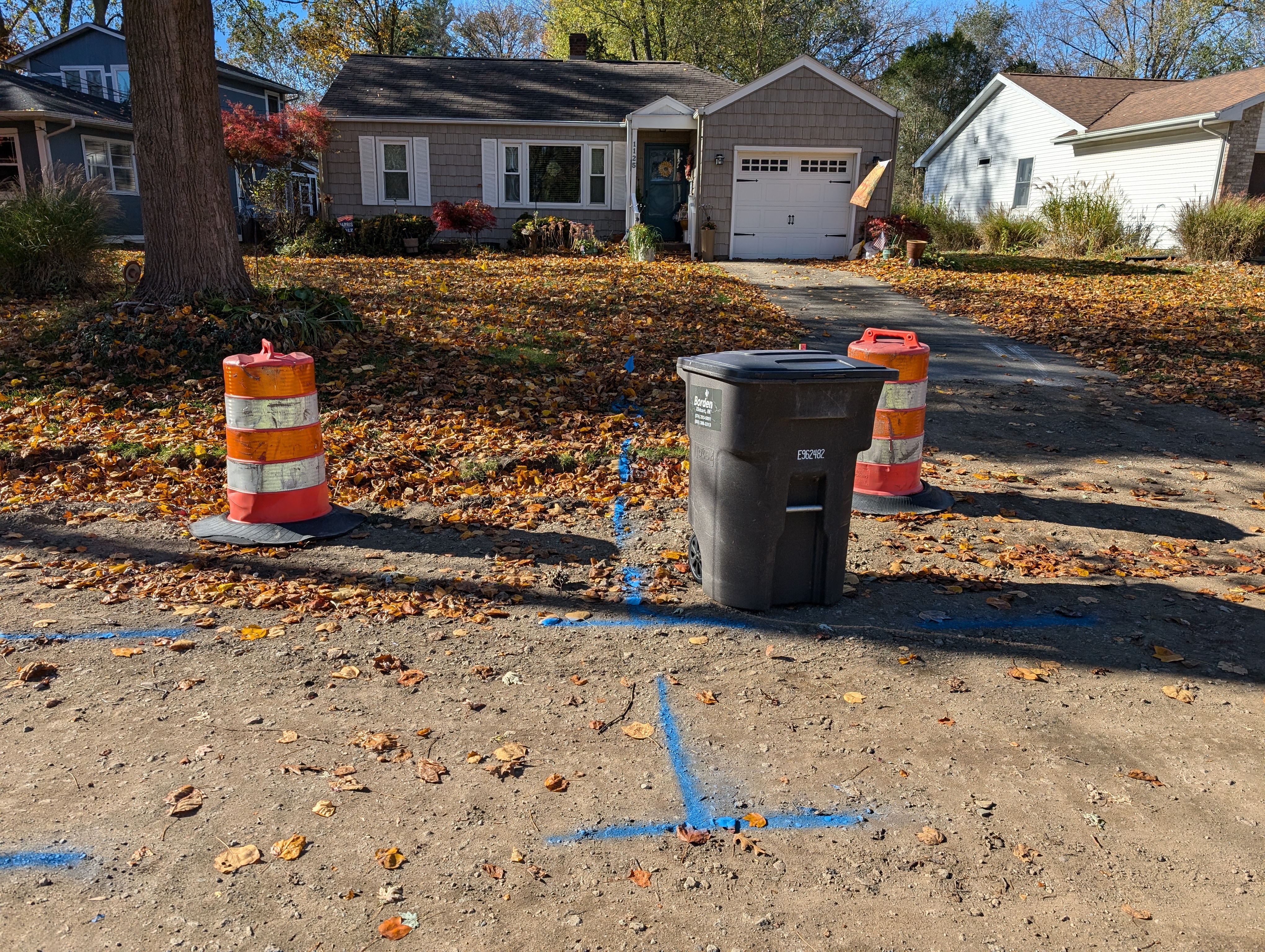 Trashcan and Two Traffic Barrels 