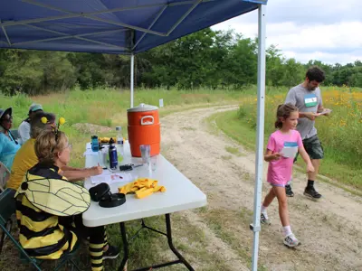 Racers and volunteers for Scavenger Hunt race at Pollinator Promenade event