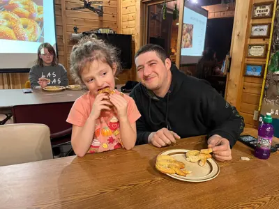Group eating pretzels at program at EEC