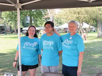 Volunteers helping at EEC booth at EnviroFest event