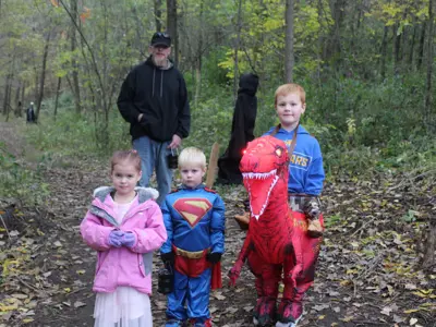 Kids in costume on trail at Haunted Walk event