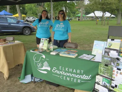 Volunteers helping at EEC booth at EnviroFest event