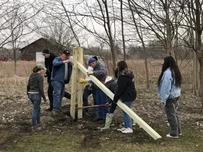 Volunteers assembling bat house at EEC