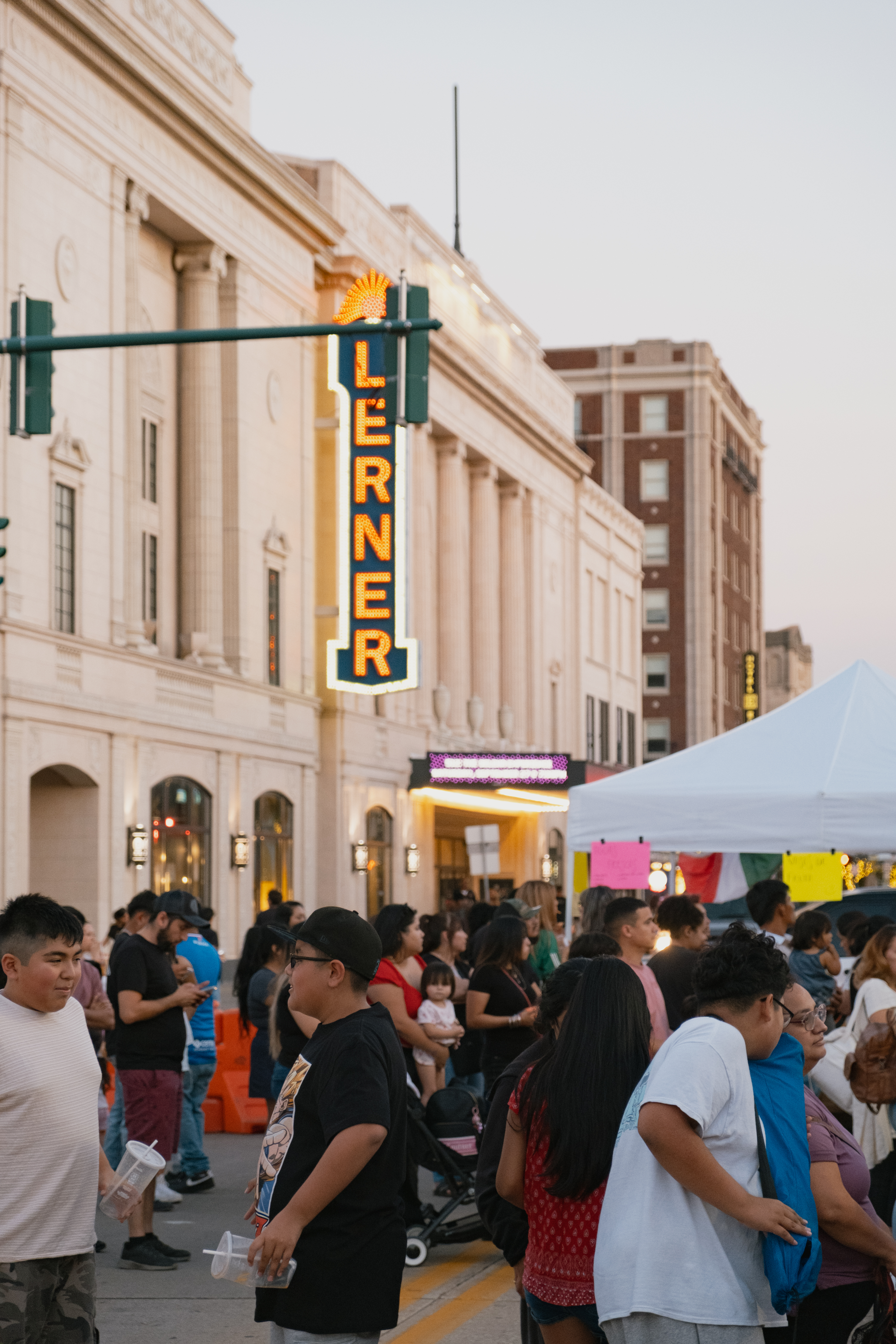 People line the street infront of the Lerner Theatre