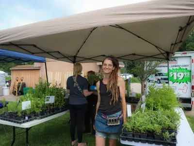 Plant sales booth at Pollinator Promenade event