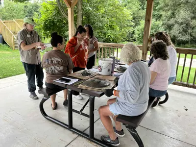 Group making concrete leaf casting at program at EEC
