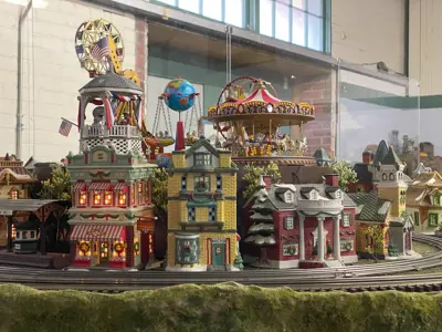 A close-up view of the carnival miniatures in the model train layout at the NNYCRRM
