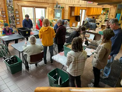 Volunteers preparing trees for Earth Day tree giveaway